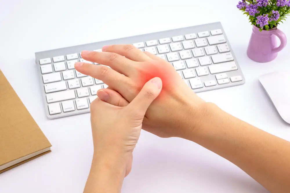Physical therapy for sharp pain in the top of your hand in Walker, MI shutterstock 439201945 hand pain treatment
