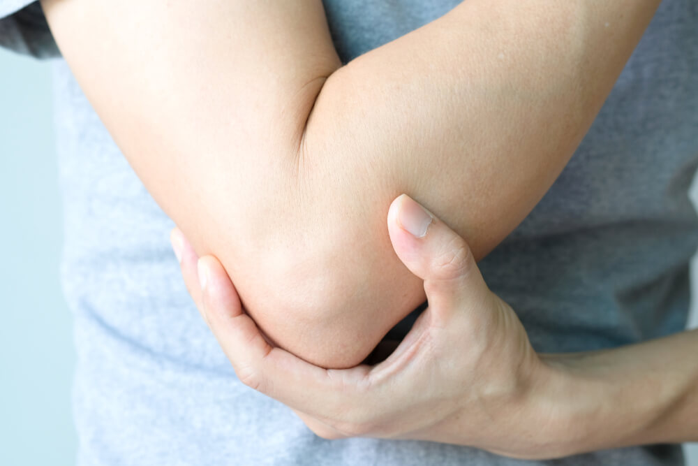 Two exercises help pain when elbow is bent or straightened shutterstock 1523898098 you might not think too much about it, but your elbows move a lot during a normal day. they bend to lift your morning cup of coffee to your lips. they twist to turn doorknobs. bending and straightening so many times every day can leave your elbows vulnerable to injury. in fact, one medical article reports that injuries like tennis elbow affect up to 3% of the u.s. population every year. people who are feeling pain when bending or straightening their elbow can find help from a physical therapist. these specialists have many techniques at their disposal, and they can combine them into a personalized plan to reduce your pain. therapeutic exercises are commonly used to treat elbow pain. there are two exercises in particular that your therapist might prescribe. wrist extensor stretch tightness in your forearm muscles is one common cause of tennis elbow, and it can also lead to elbow pain when bending or straightening your arm. physical therapists can show you how to stretch forearm muscles to reduce tightness. one exercise often used for this purpose is the wrist extensor stretch. how to do the wrist extensor stretch start by holding the affected arm straight out in front of you with your palm down. you can also rest your forearm on a table or countertop if you have trouble maintaining this position; just make sure your wrist is hanging over the edge of the surface. grasp the fingers of the affected hand with your other hand. slowly pull downward toward the floor until you feel a stretch in the outside of your forearm. hold the stretch for 10 to 15 seconds. release the stretch and rest your arm for 10 seconds. repeat these steps until you’ve done three repetitions. wrist turn physical therapists can also show you exercises that can strengthen the forearm muscles. improving strength in these muscles can help decrease pain in your elbow when it’s bent or straightened, and this goal can be accomplished with the wrist turn exercise. how to do the wrist turn exercise place the affected forearm on a table, countertop or other flat surface; your wrist should be over the edge of the surface, and your palm should be facing up. slowly turn your hand inward so that your palm is facing down. concentrate on tightening the forearm muscles during this movement. hold this position for three to five seconds. return your hand to the starting position and rest for five seconds. repeat these steps until you’ve done three sets of five repetitions. you can also use a light hand weight or can of soup to add weight, which will make the exercise more challenging. elbow pain when bending and straightening your arm can be treated at excel sports & physical therapy are you feeling pain every time your elbow is bent and straightened? excel sports & physical therapy offers treatment options that can help. our clinics offer free screenings to help you get your treatment started. we also create individualized therapy plans that meet each patient’s specific needs, and our plans often include beneficial therapy methods such as: therapeutic exercises joint mobilization kinesio taping® hand therapy joint mobilization don’t wait to start getting our help with your elbow pain. contact our team today for more information about how we can help you or to schedule an initial appointment.