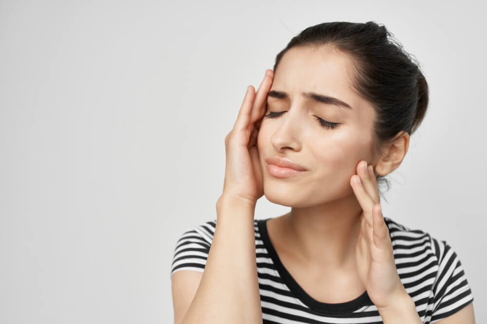 What are my treatment options for jaw pain and a headache? shutterstock 1130766161 neck and jaw pain