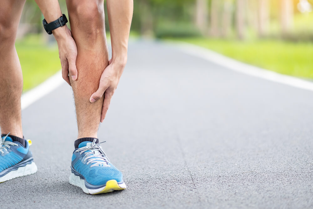 Why do I feel pain in my lower leg above the ankle when running? shutterstock 1762463504 pain in lower leg above ankle when running
