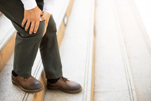 Knee hurting when you're going down stairs? One of these issues could be the reason why shutterstock 1860296830 Knee hurting when you’re going down stairs? One of these issues could be the reason why