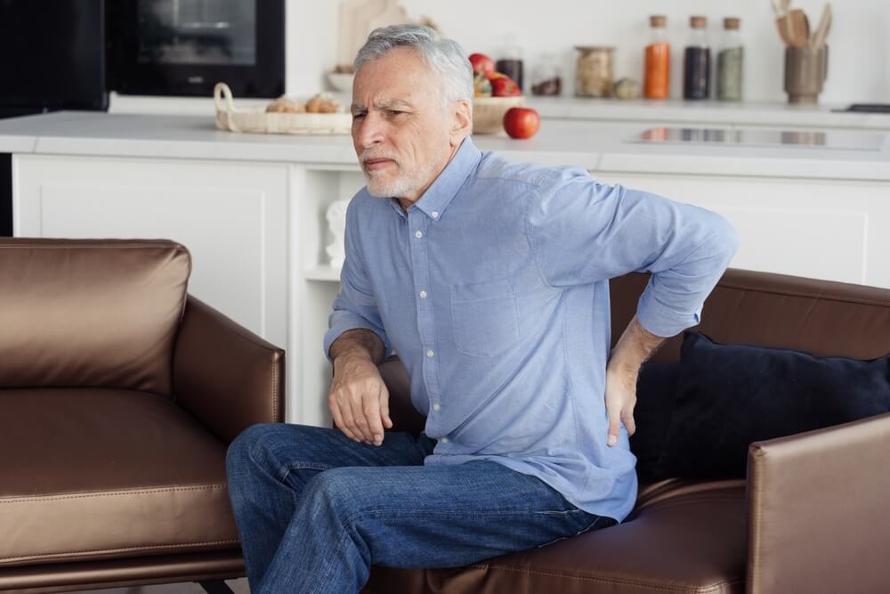 Why do I have tailbone pain when I get up and sit down? shutterstock 2173589199 is chronic pain a disability