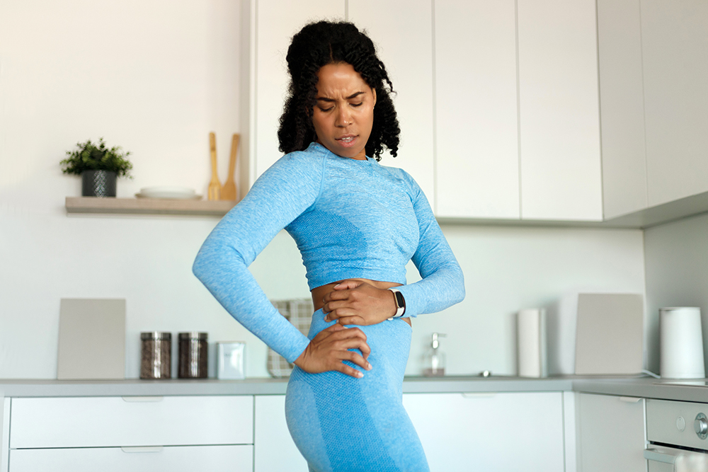 Why is one of your hips tighter than the other? 4 potential explanations dissatisfied fit black lady holding aching hip ha 2022 12 16 07 32 52 utc why is one of your hips tighter than the other? 4 potential explanations hip pain