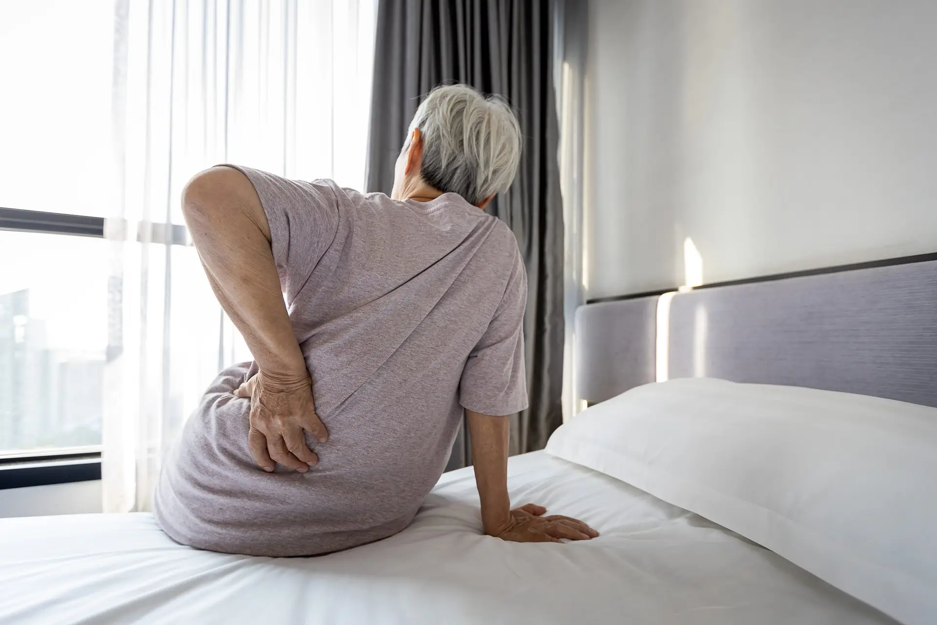 How to Relieve Hip Pain From Sleeping On Your Side AdobeStock 403583141 scaled How to Relieve Hip Pain From Sleeping On Your Side